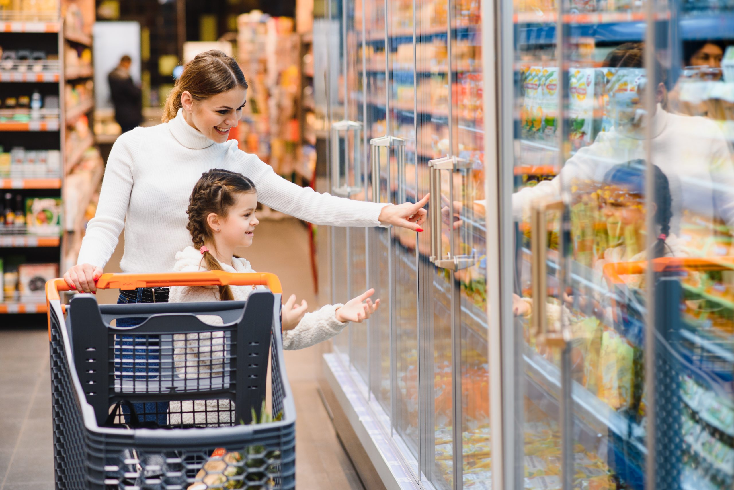 Mother with daughter at a grocery store